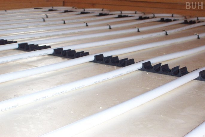 close-up photo of underfloor heating in slab and screed floor