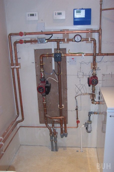 photo of plumbing for underfloor heating and oil boiler