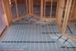 photo of underfloor heating in slab and screed floor with wall partitions